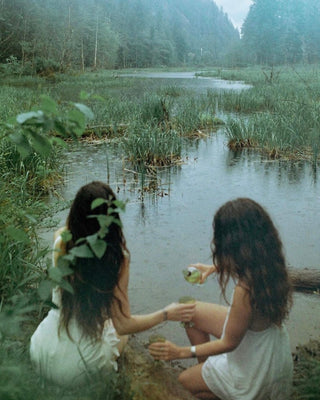 Judianne Grace's ethereal image of two young women by a lake in misty surroundings.