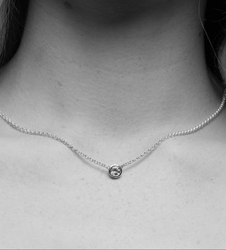 Silver necklace with a small topaz
