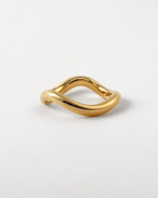 An organic solid gold wedding ring band