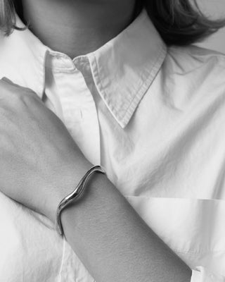 Sculptural open silver bangle